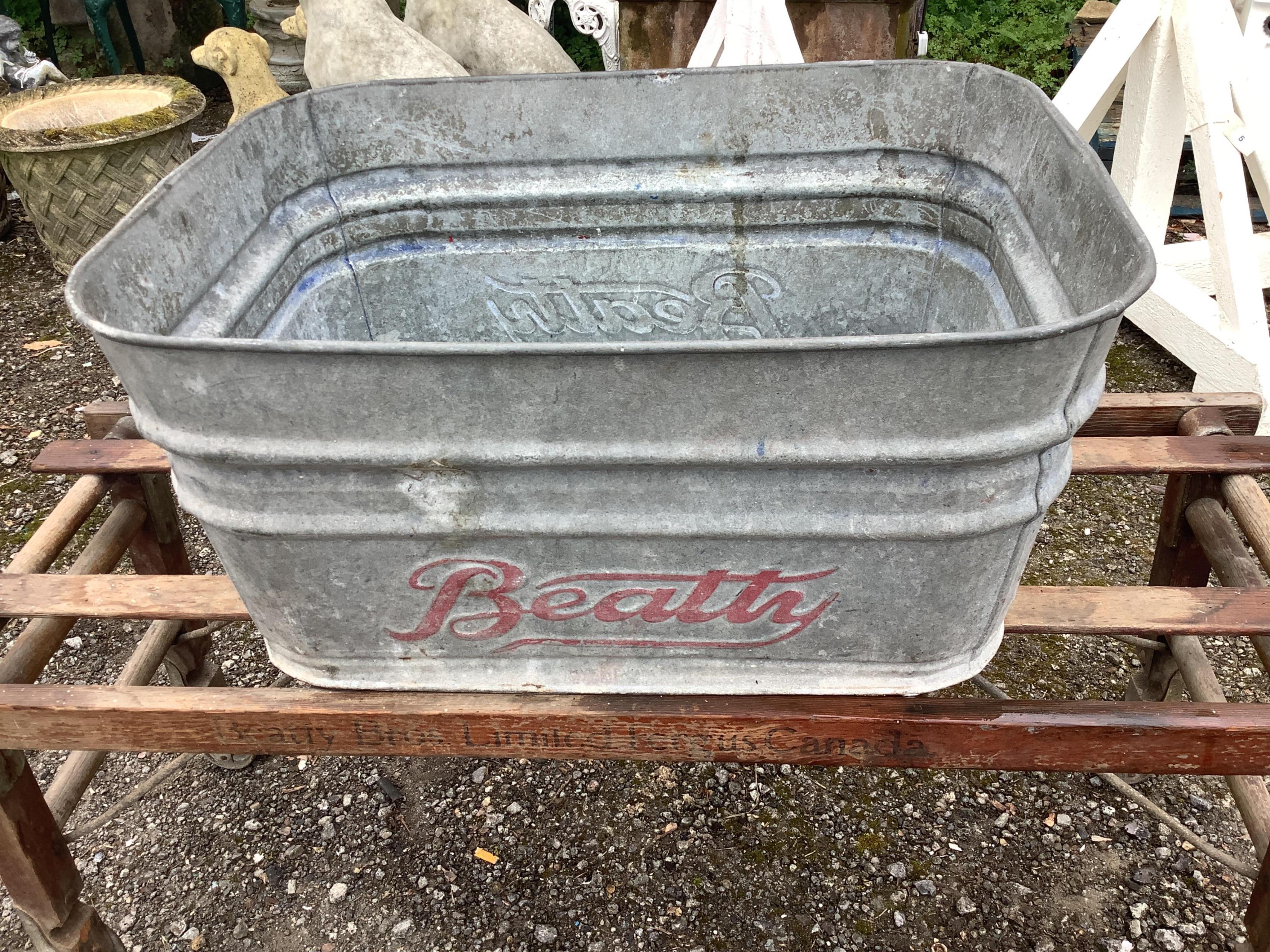 A vintage Beatty Bros. Ltd. folding wheeled stand and galvanised container, six other galvanised and enamel containers and sundries. Condition - fair